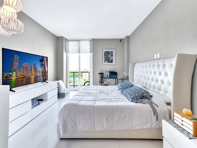 100 Bayview Dr Unit Ph01, Sunny Isles Beach, FL 33160 - bedroom featuring tile patterned floors and a wall of windows
