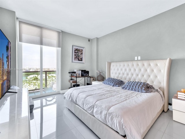 100 Bayview Dr Unit Ph01, Sunny Isles Beach, FL 33160 - tiled bedroom with baseboards and a wall of windows