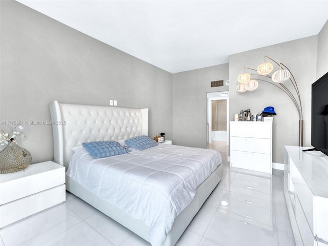100 Bayview Dr Unit Ph01, Sunny Isles Beach, FL 33160 - bedroom featuring connected bathroom, visible vents, and light tile patterned floors