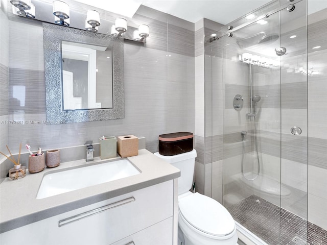 100 Bayview Dr Unit Ph01, Sunny Isles Beach, FL 33160 - full bath with a stall shower, toilet, backsplash, vanity, and tile walls