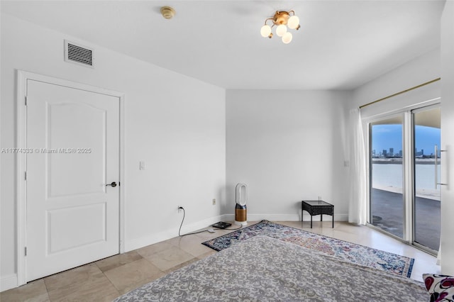 living area with baseboards and tile patterned flooring