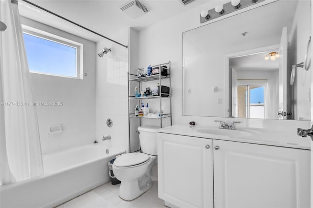 bathroom featuring plenty of natural light, shower / tub combo, tile patterned flooring, and toilet