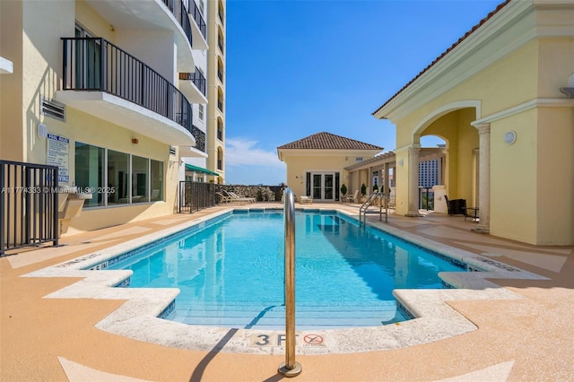 community pool featuring a patio area