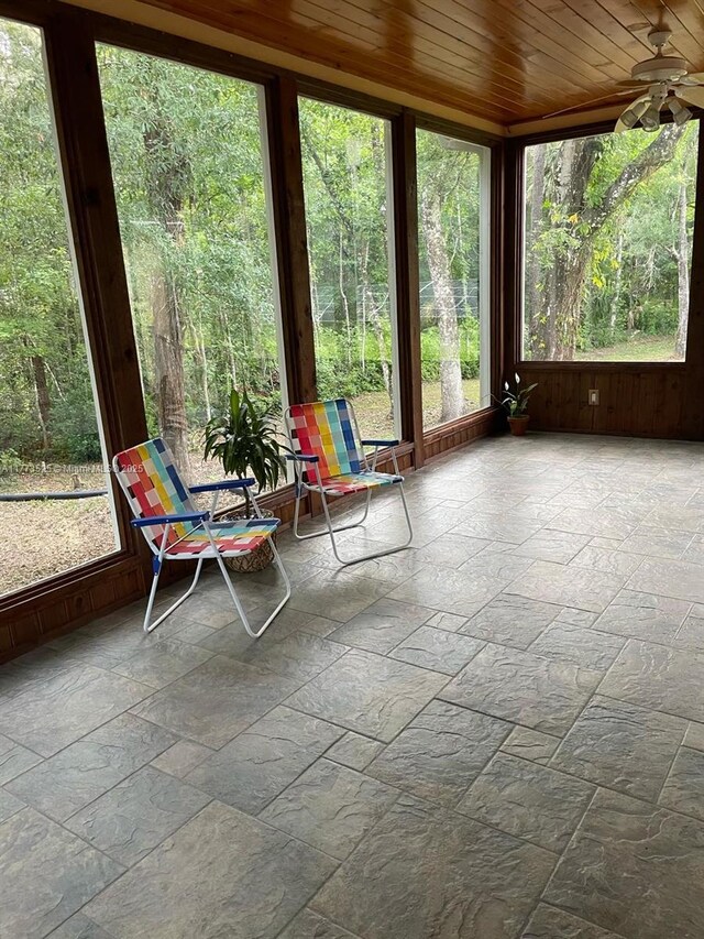 1950 S Tanner Rd, Orlando, FL 32820 - sunroom with stone tile flooring and wood ceiling