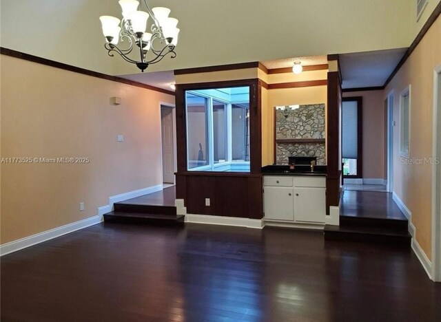 1950 S Tanner Rd, Orlando, FL 32820 - unfurnished dining area featuring crown molding, dark wood-style floors, baseboards, and a chandelier
