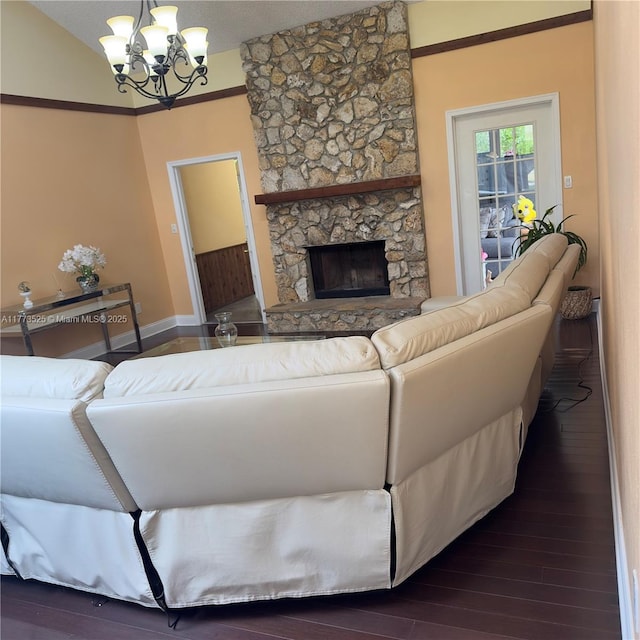 1950 S Tanner Rd, Orlando, FL 32820 - living room with a chandelier, wood finished floors, baseboards, and a stone fireplace