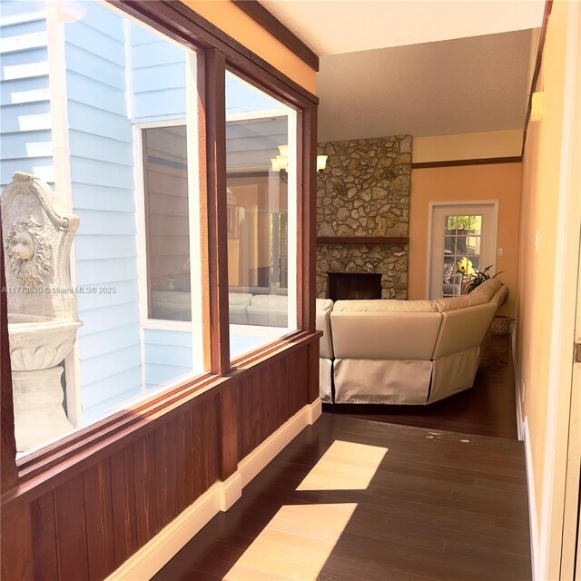 1950 S Tanner Rd, Orlando, FL 32820 - living room with dark wood finished floors, a fireplace, and baseboards