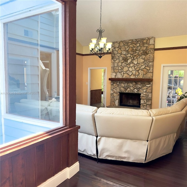 1950 S Tanner Rd, Orlando, FL 32820 - living room with a chandelier, dark wood-style floors, a fireplace, and vaulted ceiling