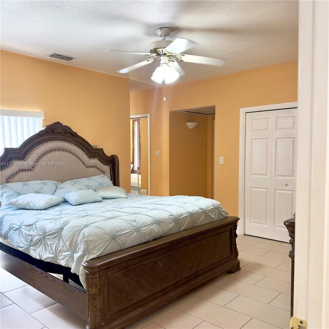 1950 S Tanner Rd, Orlando, FL 32820 - bedroom with light tile patterned floors and a ceiling fan