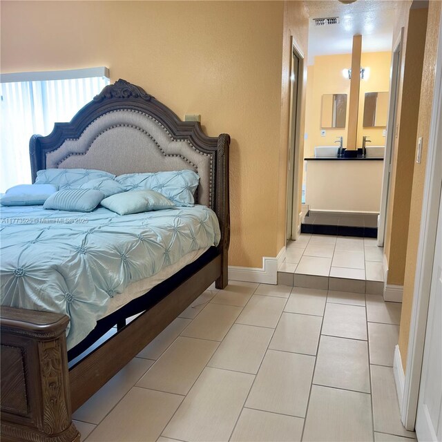 1950 S Tanner Rd, Orlando, FL 32820 - bedroom featuring tile patterned flooring and baseboards
