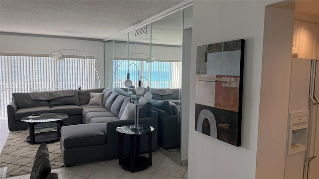1950 S Ocean Dr Unit 6G, Hallandale Beach, FL 33009 - living area featuring light tile patterned flooring, a textured ceiling, and crown molding