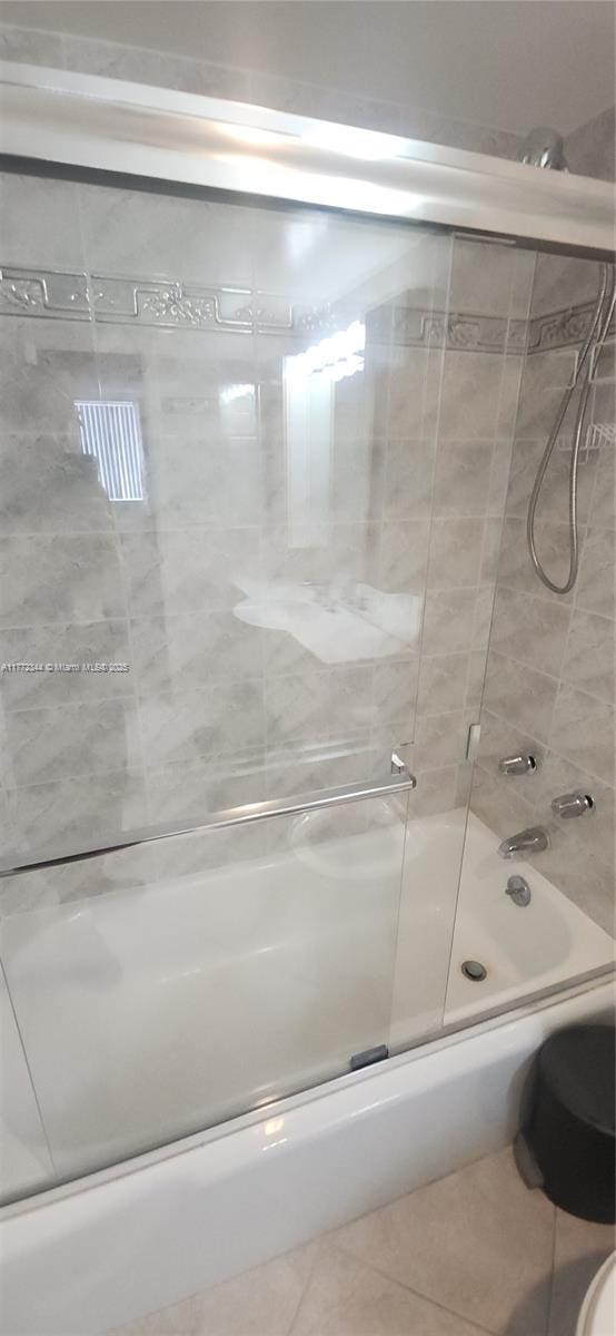 1950 S Ocean Dr Unit 6G, Hallandale Beach, FL 33009 - full bath with tile patterned flooring, shower / bath combination with glass door, and toilet