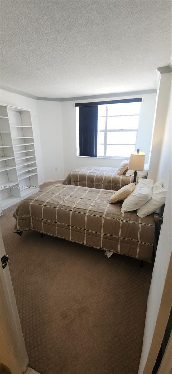 1950 S Ocean Dr Unit 6G, Hallandale Beach, FL 33009 - carpeted bedroom featuring a textured ceiling
