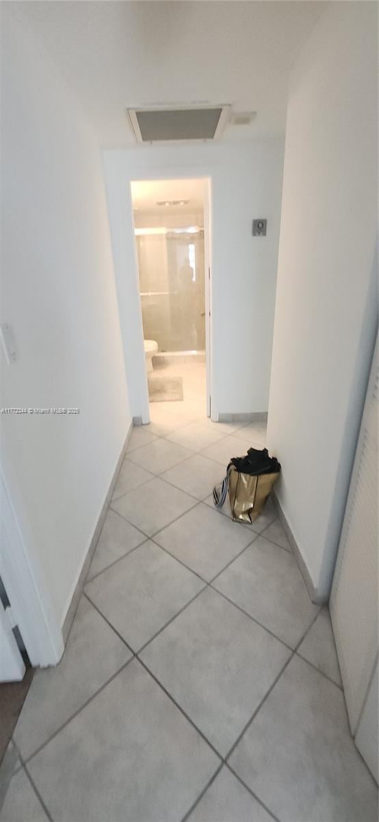 1950 S Ocean Dr Unit 6G, Hallandale Beach, FL 33009 - hallway with light tile patterned floors and baseboards