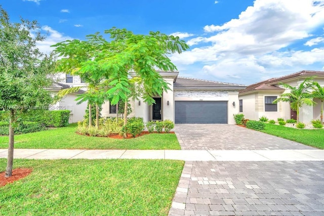 17451 SW 41st St, Miramar, FL 33029 - view of front of property with decorative driveway, a garage, a front yard, and stucco siding