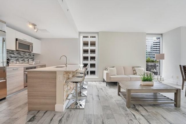 1300 Brickell Bay Dr Unit 601, Miami, FL 33131 - living room with light wood finished floors