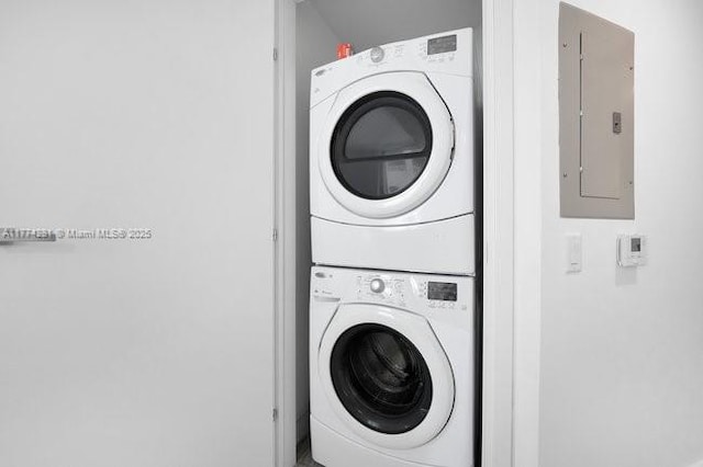 1300 Brickell Bay Dr Unit 601, Miami, FL 33131 - washroom featuring laundry area, stacked washing maching and dryer, and electric panel