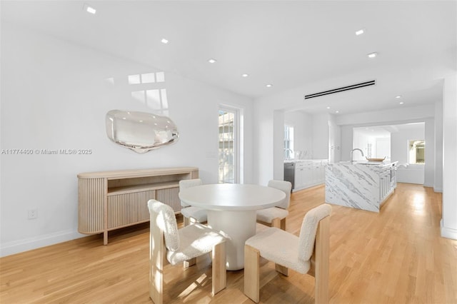 6675 Roxbury Ln, Miami Beach, FL 33141 - dining room with baseboards, recessed lighting, and light wood-style floors