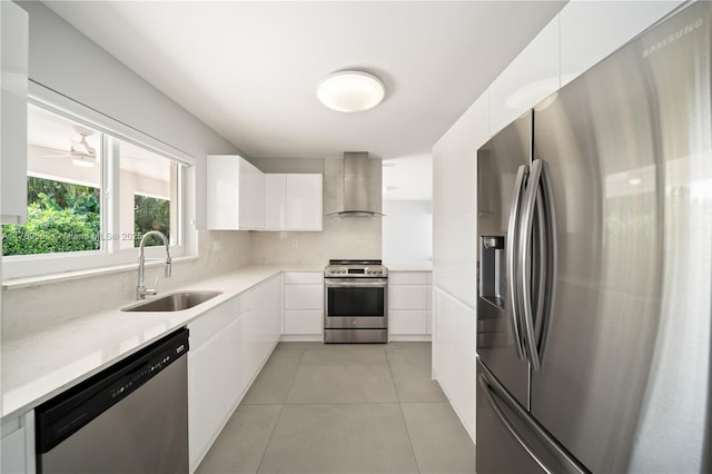 6881 SW 94th Ave, Miami, FL 33173 - kitchen with stainless steel appliances, wall chimney range hood, a sink, modern cabinets, and white cabinets
