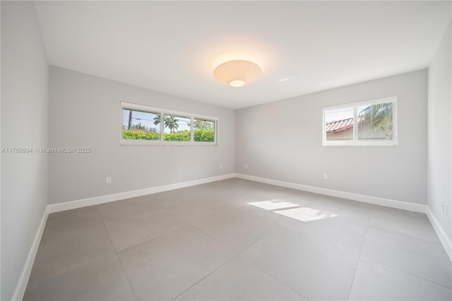 6881 SW 94th Ave, Miami, FL 33173 - tiled empty room featuring baseboards