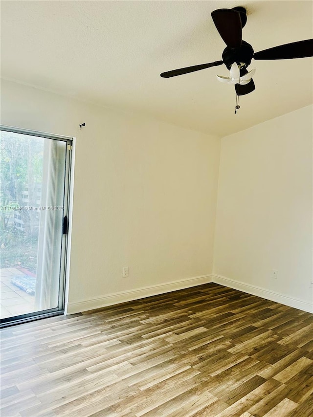 15016 SW 139th Pl, Miami, FL 33186 - empty room with wood finished floors, a ceiling fan, and baseboards