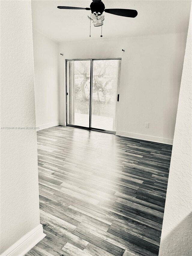 15016 SW 139th Pl, Miami, FL 33186 - empty room with ceiling fan, baseboards, wood finished floors, and a textured wall
