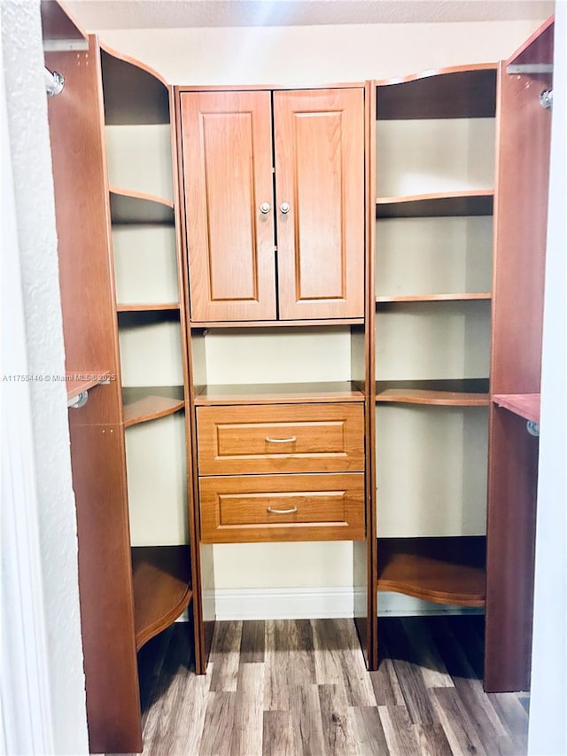 15016 SW 139th Pl, Miami, FL 33186 - spacious closet featuring wood finished floors