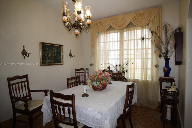 dining room featuring a notable chandelier