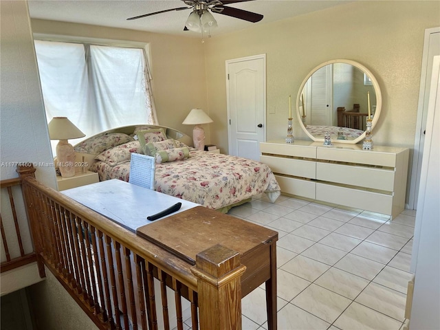 bedroom with light tile patterned floors and a ceiling fan