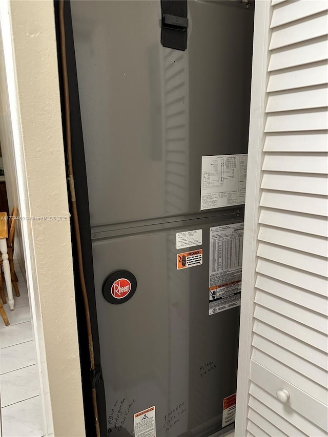 utility room featuring heating unit