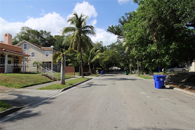 view of street featuring curbs and sidewalks
