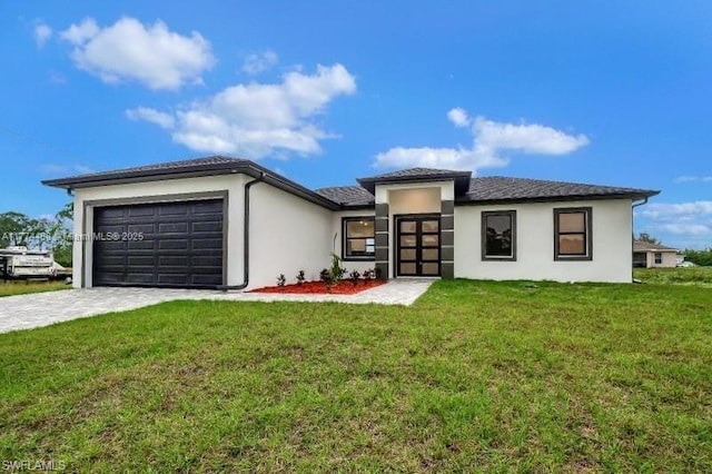 3114 39th St SW, Lehigh Acres, FL 33976 - prairie-style home with stucco siding, an attached garage, a front yard, and driveway