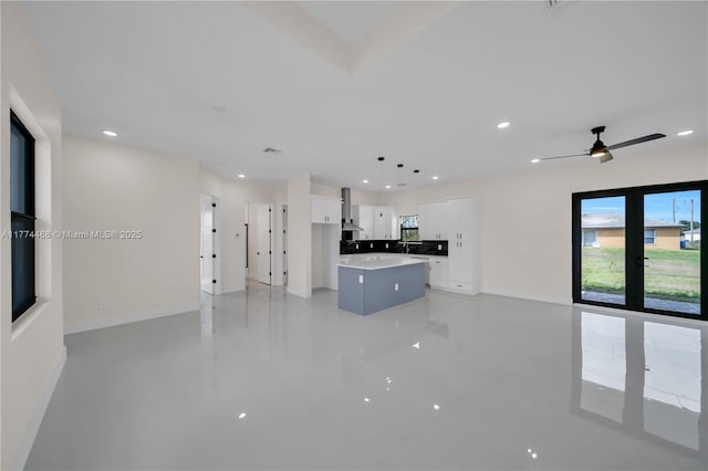 3114 39th St SW, Lehigh Acres, FL 33976 - unfurnished living room with baseboards, ceiling fan, and recessed lighting
