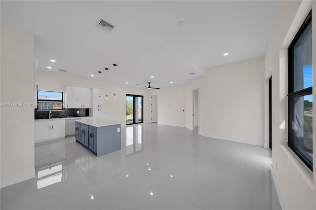 3114 39th St SW, Lehigh Acres, FL 33976 - kitchen with open floor plan, recessed lighting, a kitchen island, visible vents, and white cabinets
