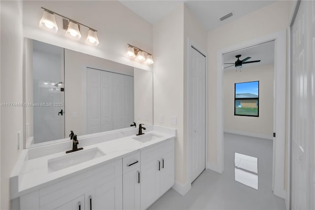 3114 39th St SW, Lehigh Acres, FL 33976 - bathroom with a ceiling fan, a sink, and a closet