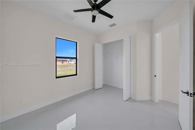 3114 39th St SW, Lehigh Acres, FL 33976 - unfurnished bedroom featuring finished concrete flooring, a closet, baseboards, and visible vents