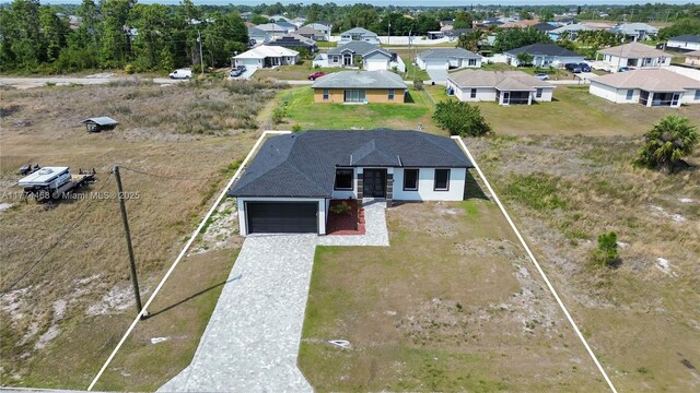 3114 39th St SW, Lehigh Acres, FL 33976 - drone / aerial view with a residential view