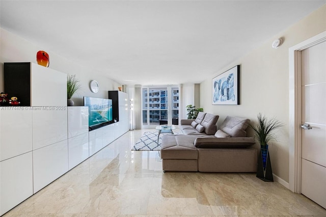 living room with baseboards and expansive windows