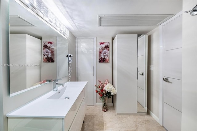 bathroom featuring visible vents and vanity