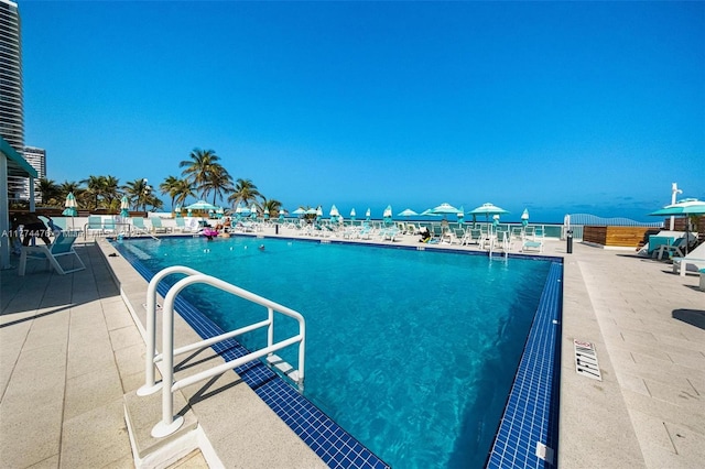 community pool featuring a water view