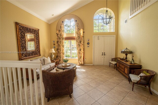 16473 SW 30th St, Miramar, FL 33027 - entrance foyer featuring light tile patterned floors, a high ceiling, and ornamental molding