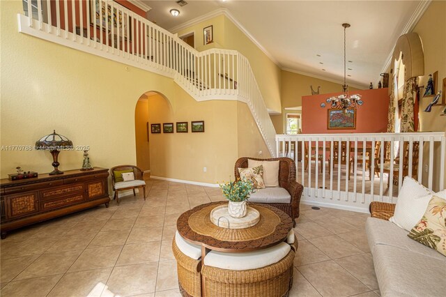 16473 SW 30th St, Miramar, FL 33027 - tiled living area with arched walkways, ornamental molding, a chandelier, and high vaulted ceiling