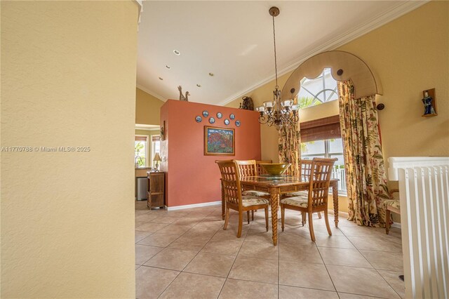 16473 SW 30th St, Miramar, FL 33027 - dining area with radiator, light tile patterned floors, a chandelier, high vaulted ceiling, and crown molding