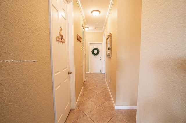 16473 SW 30th St, Miramar, FL 33027 - hallway featuring crown molding, a textured wall, and light tile patterned floors