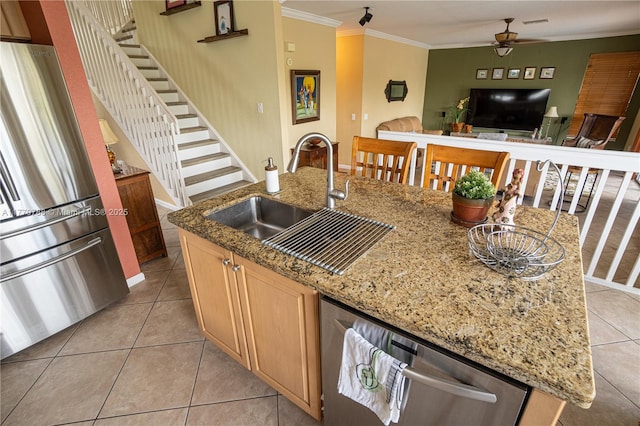 16473 SW 30th St, Miramar, FL 33027 - kitchen featuring stainless steel appliances, light tile patterned flooring, an island with sink, a ceiling fan, and crown molding