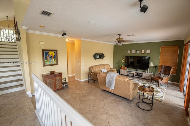 16473 SW 30th St, Miramar, FL 33027 - living area featuring ceiling fan, tile patterned floors, crown molding, a textured ceiling, and stairs