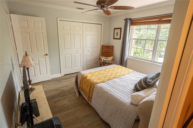 16473 SW 30th St, Miramar, FL 33027 - bedroom featuring ornamental molding, dark wood-style floors, a closet, and a ceiling fan