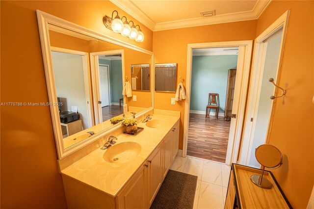 16473 SW 30th St, Miramar, FL 33027 - bathroom with double vanity, crown molding, and marble look tile flooring