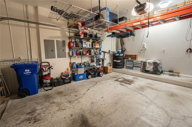 16473 SW 30th St, Miramar, FL 33027 - garage with electric panel, a garage door opener, and a textured wall