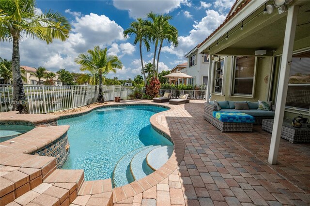 16473 SW 30th St, Miramar, FL 33027 - view of swimming pool with a patio, a fenced backyard, and a pool with connected hot tub